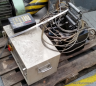Automatický podavač plechových svitků s odměřováním (Automatic feeding machine of metal coils) 